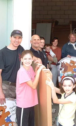 Families gathered at a Children of Fallen Soldiers holiday gift drop