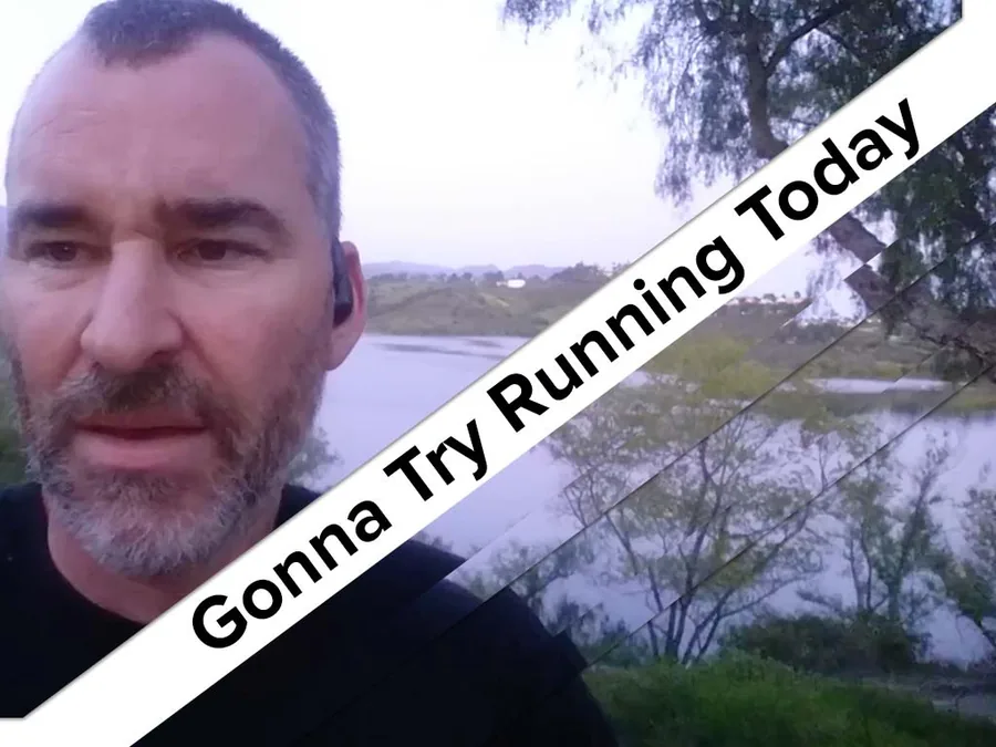 Grinning outdoors under a banner reading 'Gonna Try Running Today'