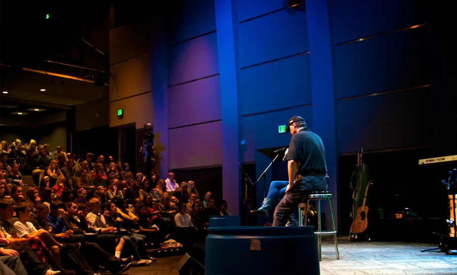 On stage in front of a packed room