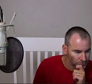 At the studio microphone, thinking it through