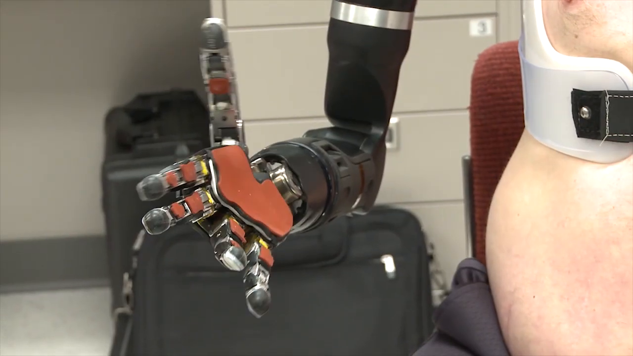 Robotic hand's mechanical detail visible