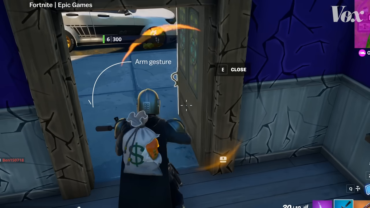 Gameplay footage of Fortnite with an animated arrow overlay pointing out the subtle arm gesture the character makes when opening a door without touching it.