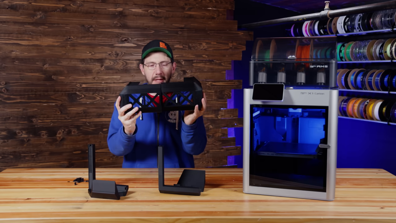 [02:16]  — A close-up showing the junction of two printed pieces and the specific slots where the bowtie connector fits to lock them together.