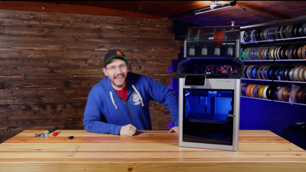 [03:48]  — A wide shot showing the fully installed riser sitting atop the 3D printer, with the AMS placed back on top.